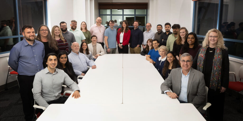Hight Jackson Associates Architecture Firm team sitting in conference room